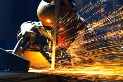 worker manufacturing metal goods