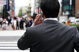 businessman talking on the phone on the street
