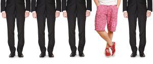 Line-of-businessmen-with-one-dressed-in-shorts