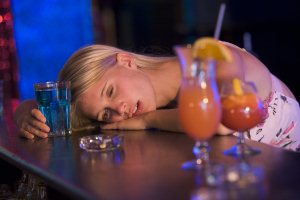 Drunk woman passed out at bar