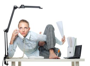 Flexible woman on office desk