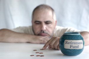 Man counts pennies for retirement piggy bank