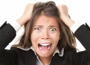 Woman stressed and going crazy pulling her hair