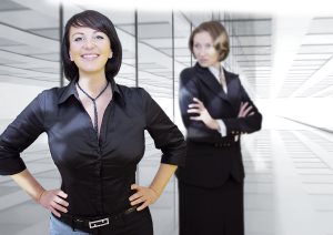 Woman looks at coworker jealously