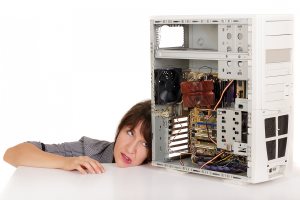 business woman grimacing with broken computer