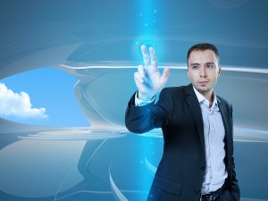 young businessman touching virtual interface button. Pillar of transparent blue light.