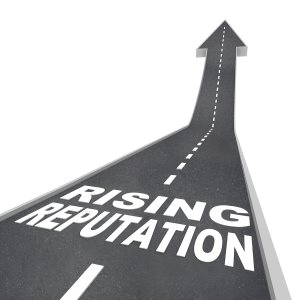 The words Rising Reputation on a road leading higher with an arrow pointing up