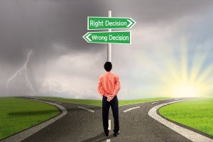 Businessman is thinking between right decisions or wrong decisions