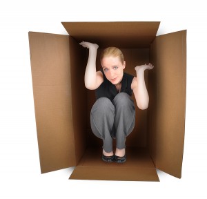 business woman is trapped in a small box with anxiety 