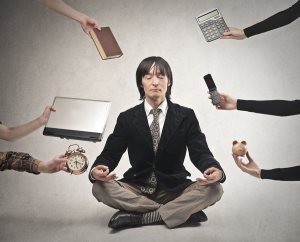 businessman is meditating to relieve stress
