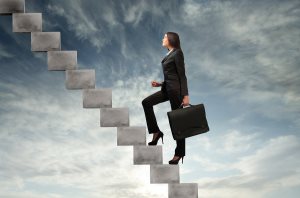 Businesswoman stepping up a stairway