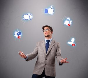 boy standing and juggling with social media icons