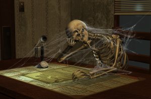 Bored skeleton at desk