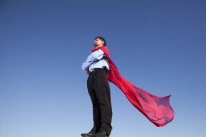 Businessman with a red flying cape like superman