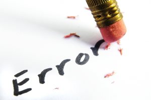 closeup of a pencil erasing an error