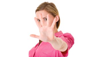 unhappy woman with stay away gesture