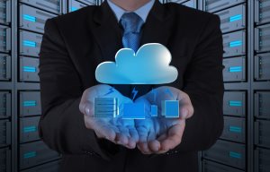 Businessman hand working with a Cloud Computing diagram