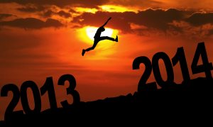 Silhouette Of Man Jumping At Sunset Toward 2014