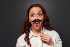 amazed woman with fake mustache