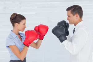 Colleagues in competition having a boxing match