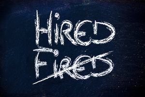 Hired Vs. Fired Message On Chalkboard
