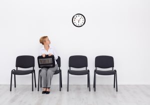 Still waiting for the job interview - woman checking time