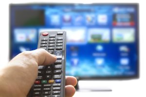 Smart Tv And Hand Pressing Remote Control
