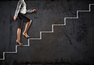 businesswoman climbing career ladder