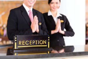 reception team at luxury hotel front desk 