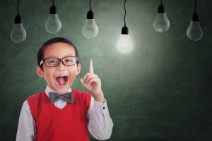 Boy Has Idea Under Light Bulb In Class