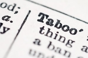 Taboo word in dictionary (macro close-up view)