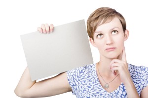 Undecided Woman Holding Blank Card