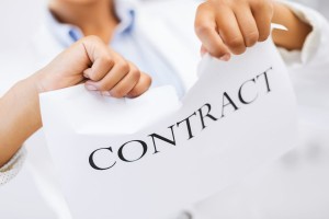 woman hands tearing contract paper