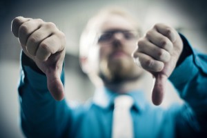 Businessman Showing Thumbs Down Gesture 