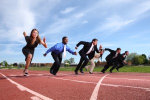Businesspeople race on track