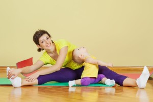 Mother Does Phisical Exercises With Her Daughter 