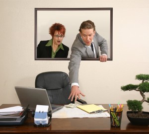 business team in portrait on wall stealing money from desk