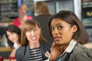 Business woman worried about angry coworker