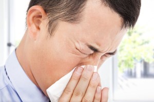 Man Is Sneezing With Toilet Paper