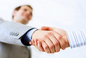 business handshake at meeting