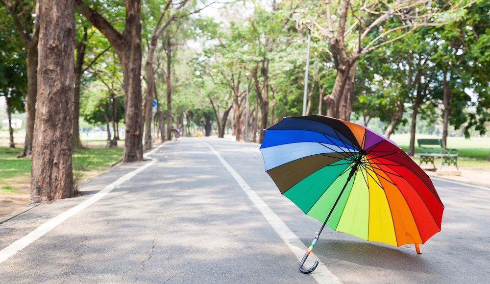 Multicolored Umbrella On The Sidewalk